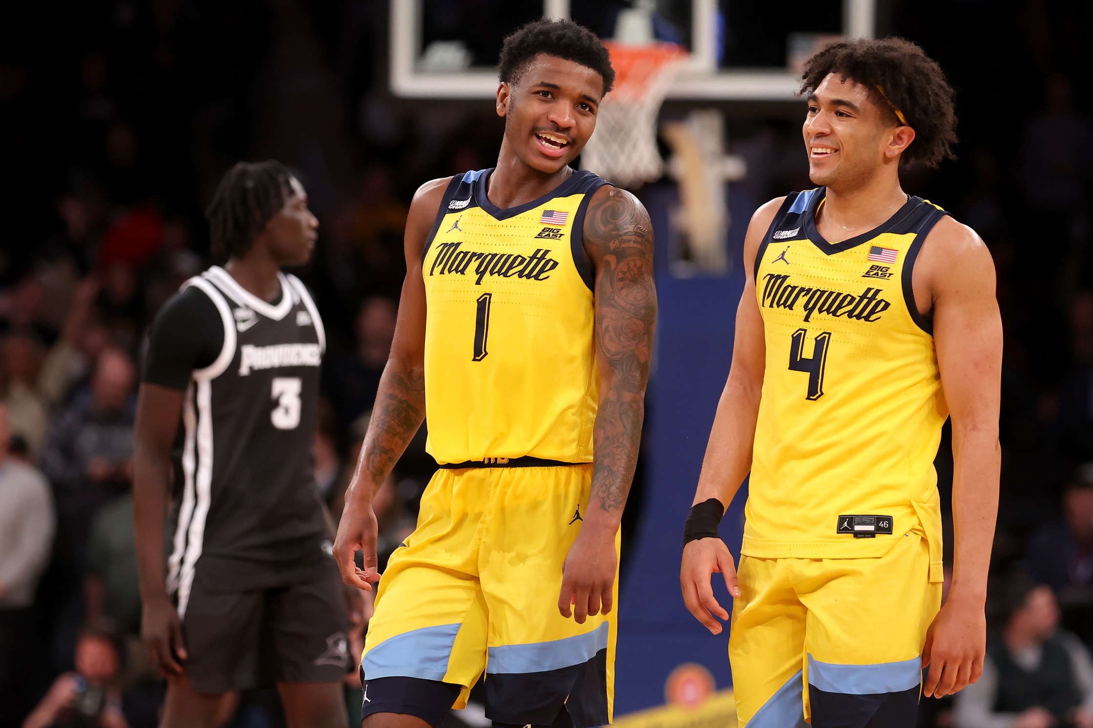 Mar 15, 2024; New York City, NY, USA; Marquette Golden Eagles guards Kam Jones (1) and Stevie Mitchell (4) react during the second half against the Providence Friars at Madison Square Garden.